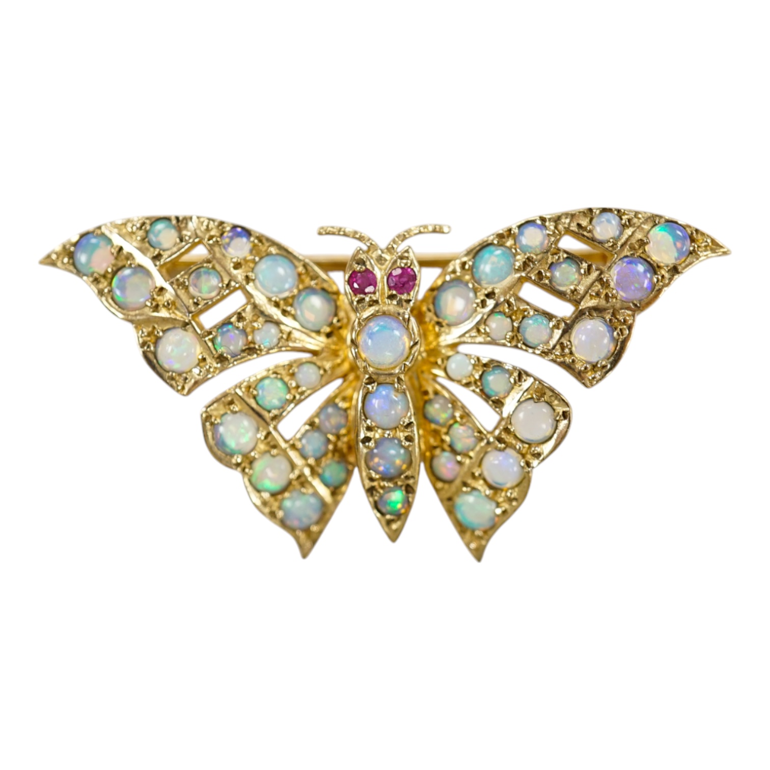 A modern 9ct gold and opal cluster set butterfly brooch, with ruby eyes, width 40mm, gross weight 4.8 grams. Condition - good